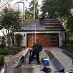Dark Bronze New Roof Installation of Standing Seam Metal with On-site Roll Former Roof Over Shingles Installation